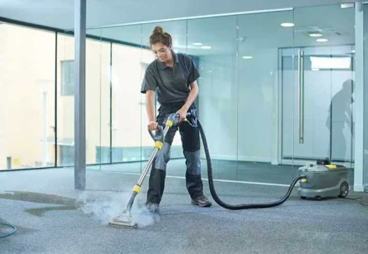 carpet cleaning lady doing steam carpet cleaning